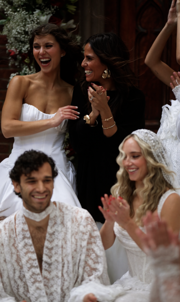 Rime Arodaky celebrates with her models at the NYBFW show.